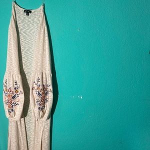 White cardigan with embroidered flowers on sleeves